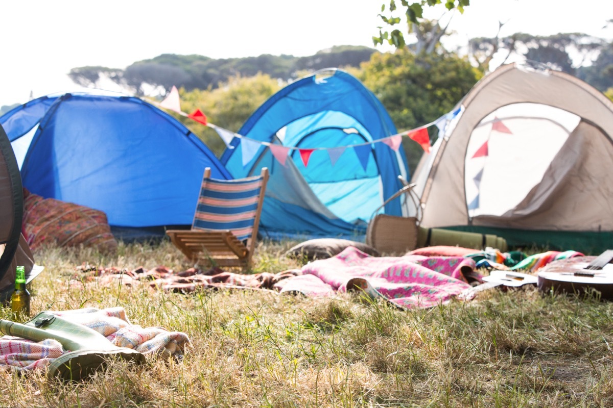 an empty campsite with clothes laying around