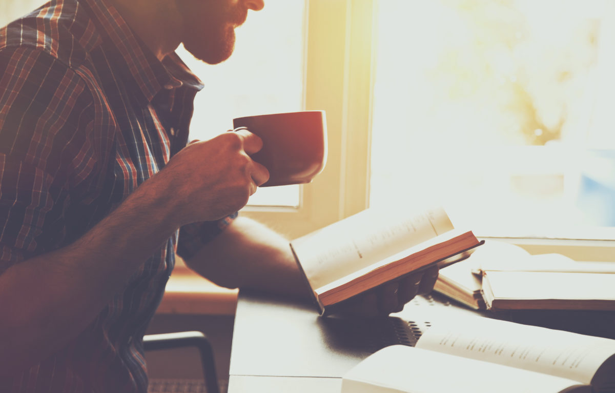 Man Reading Poems and Drinking Coffee