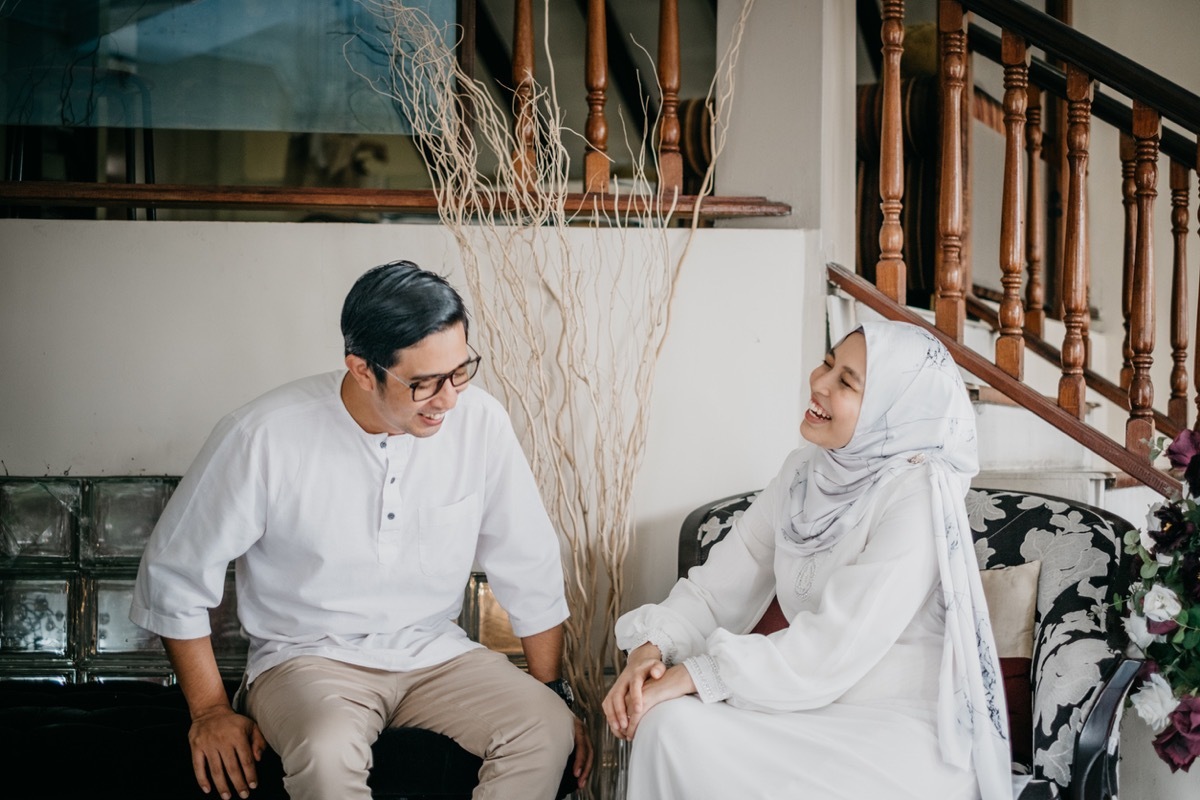 muslim siblings smiling and laughing together