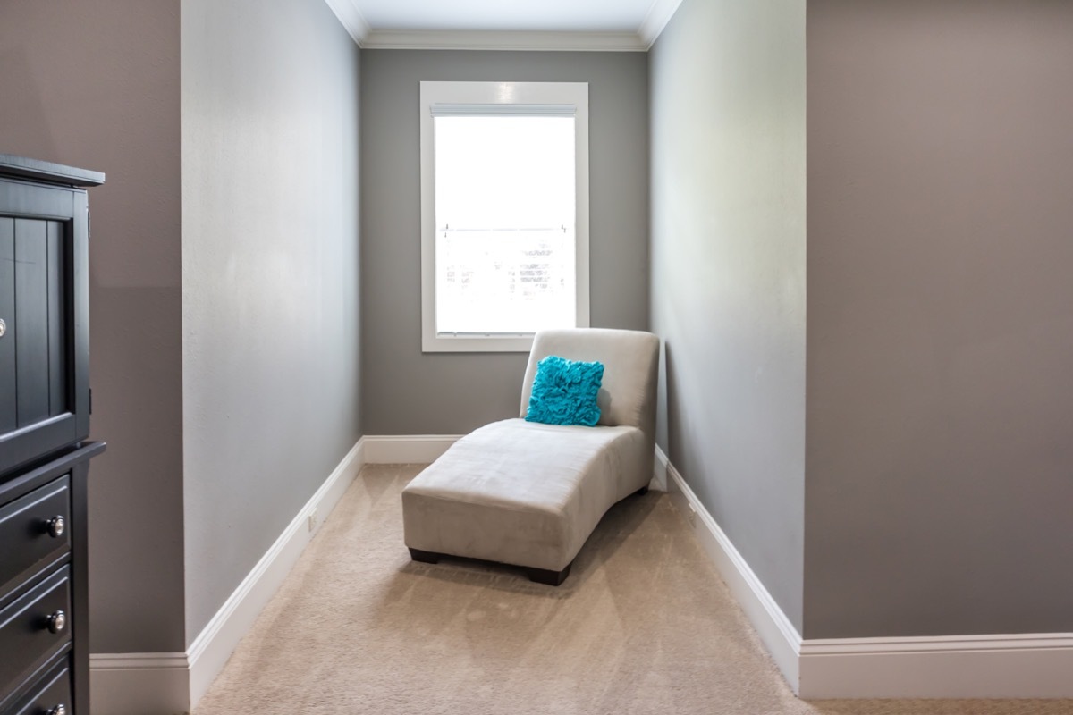 A dormer window inset perfect for a sitting area with a chaise lounge chair to read books or nap.