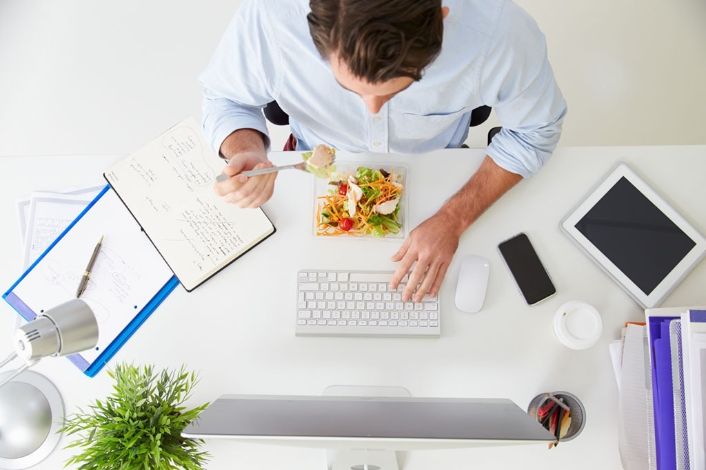 Man working and eating