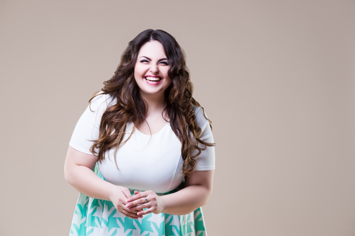 Very Enthusiastic Woman Against Beige Background