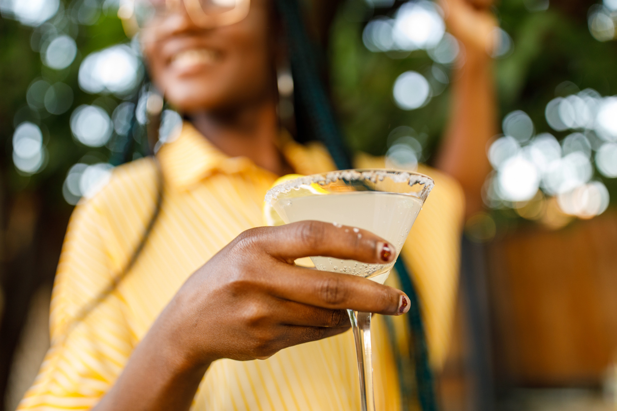 Woman drinking a cocktail.