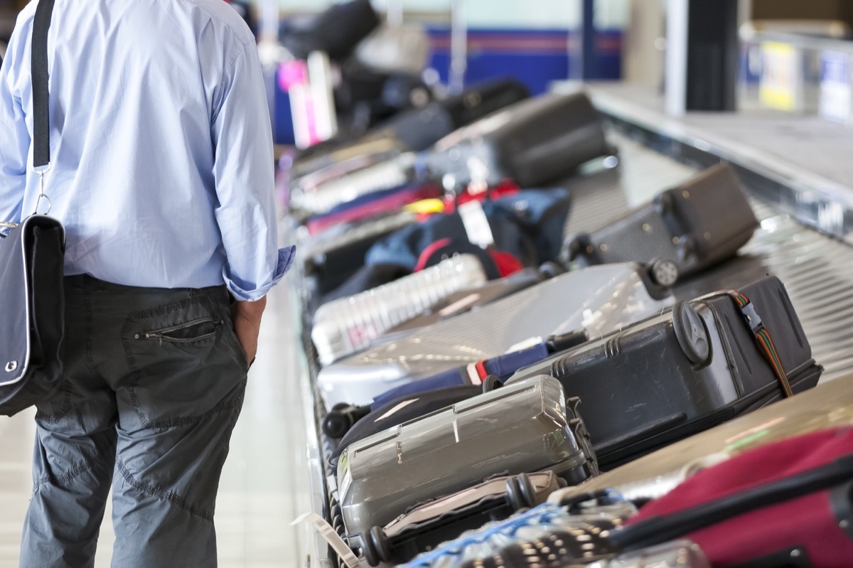 man at baggage claim