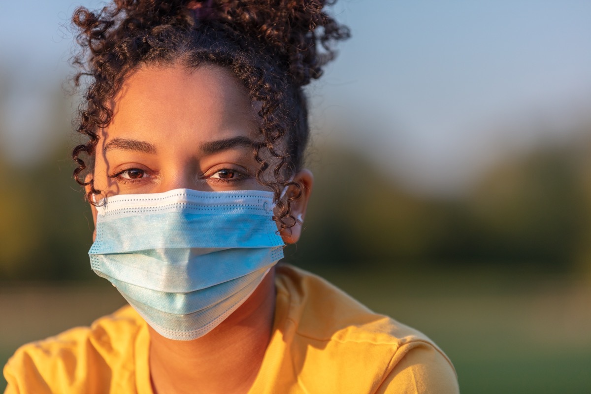 Teenager wearing a mask