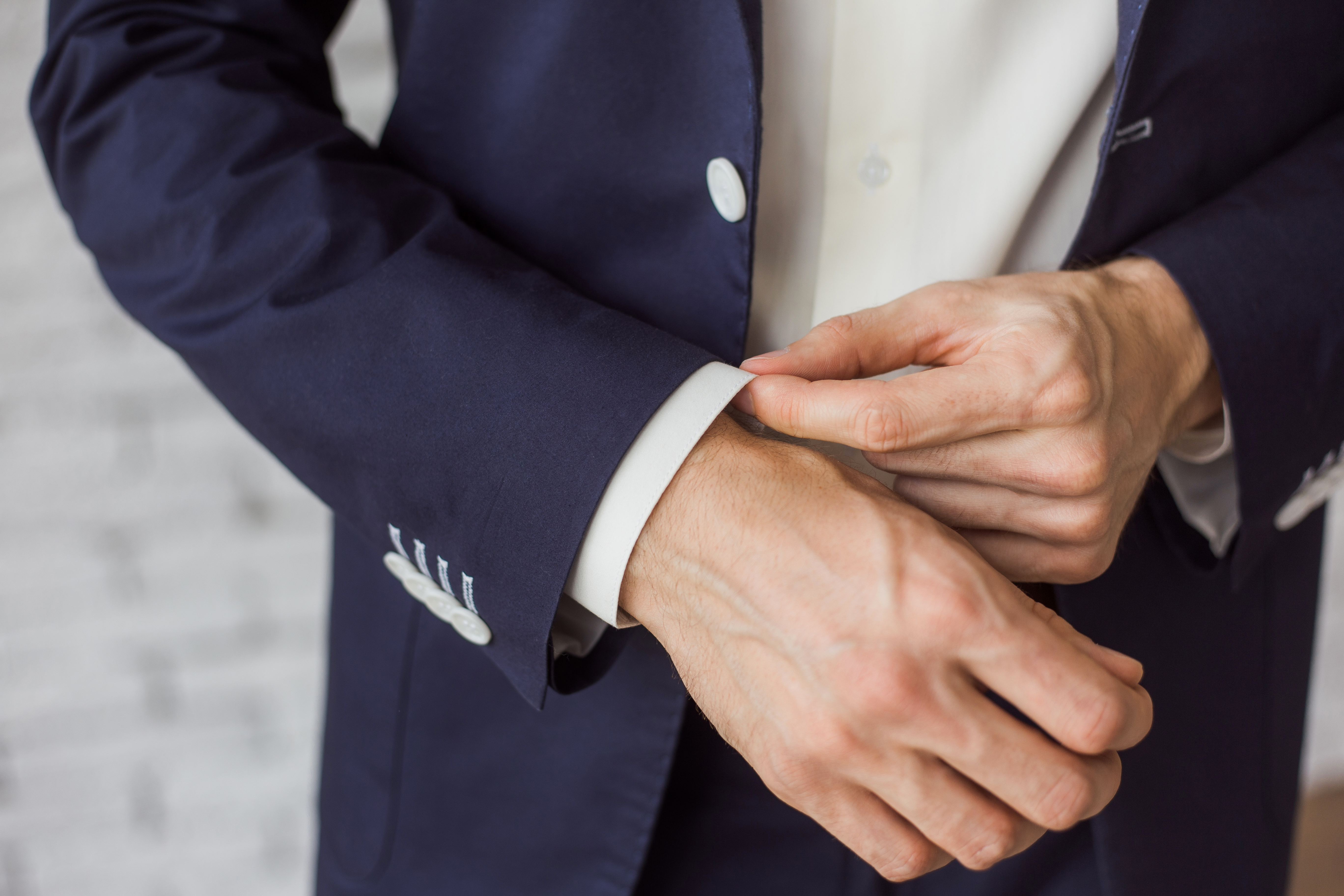 Close-up of man dressed elegantly in blue suit