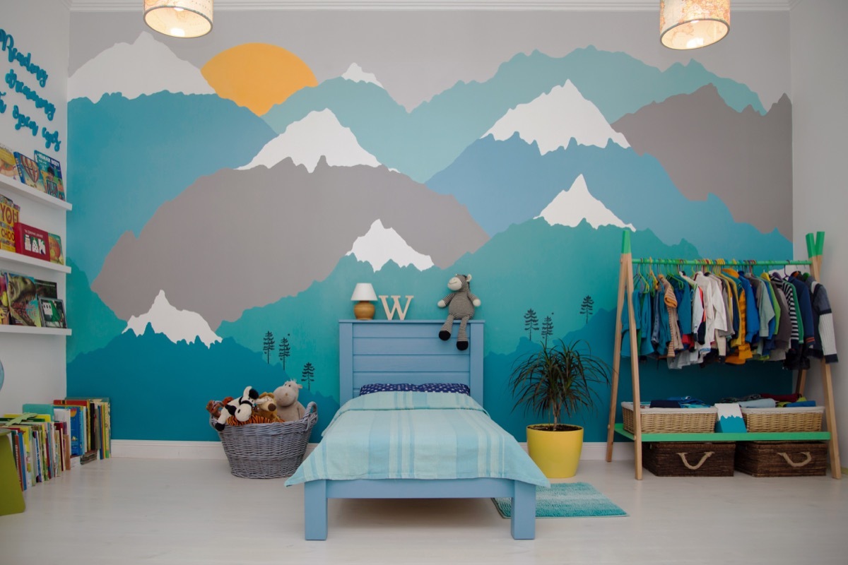 Little boy's bedroom with a mountain mural