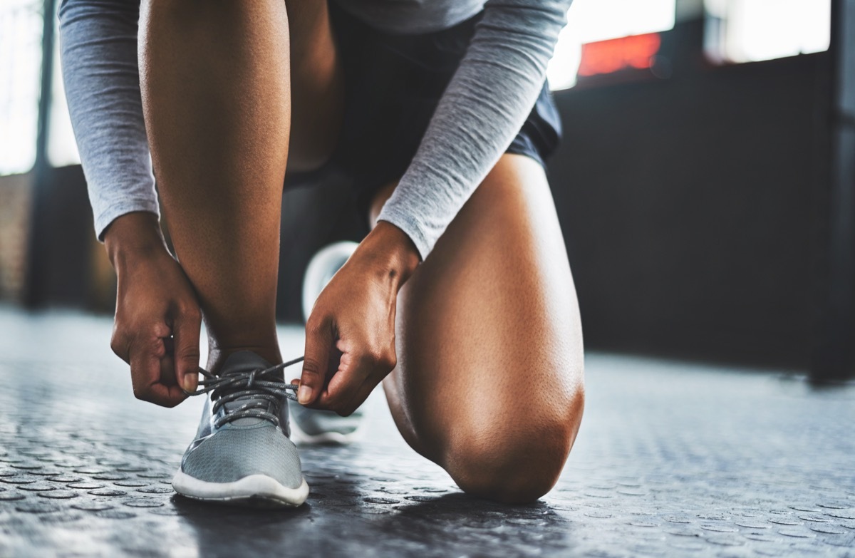 woman tying her running shoes, NASA every items