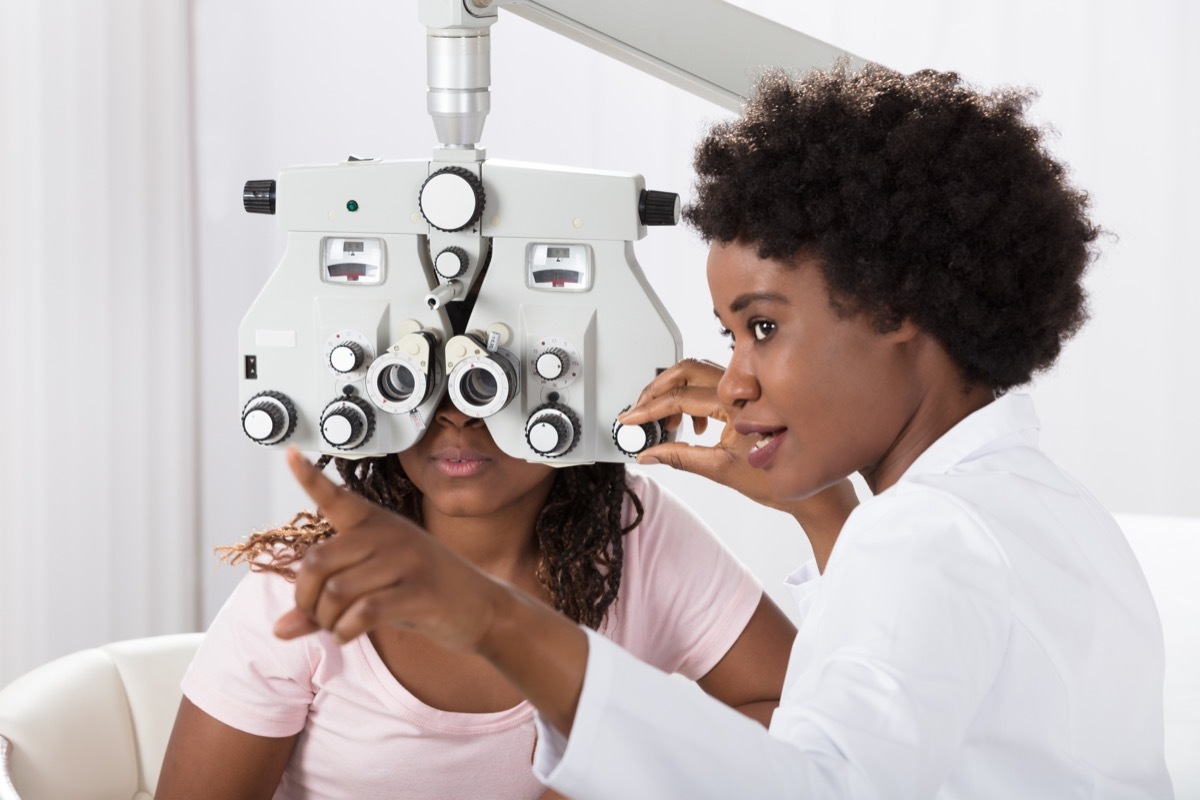 Black woman at the eye doctor getting her eyes checked