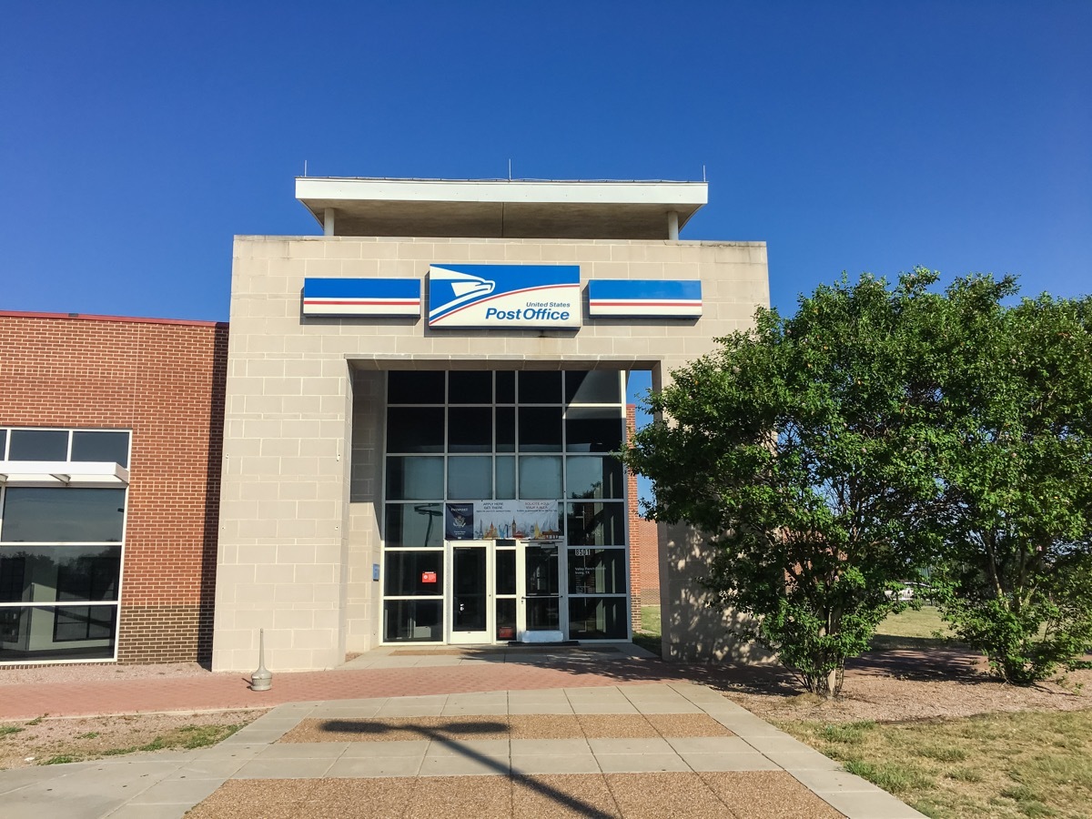 USPS store sunny summer clear blue sky. The United States Postal Service is an independent agency of US federal government providing postal service