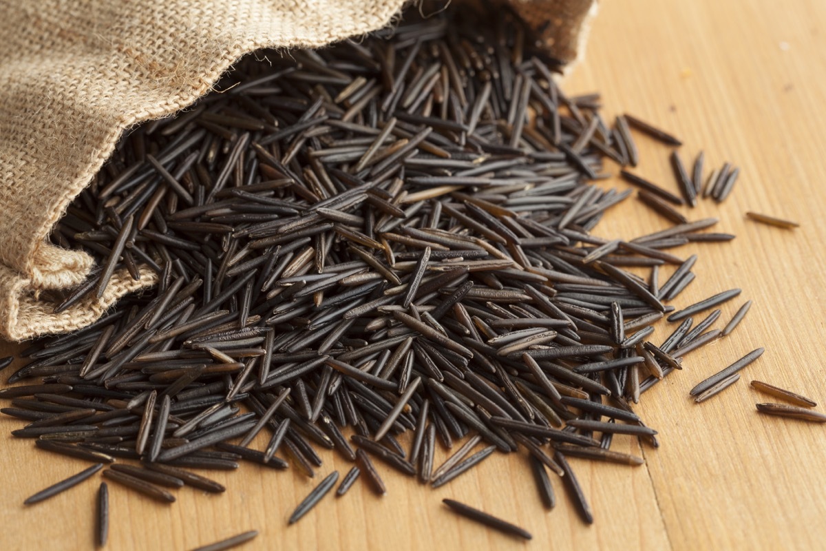 wild grain rice spilling out of a bag