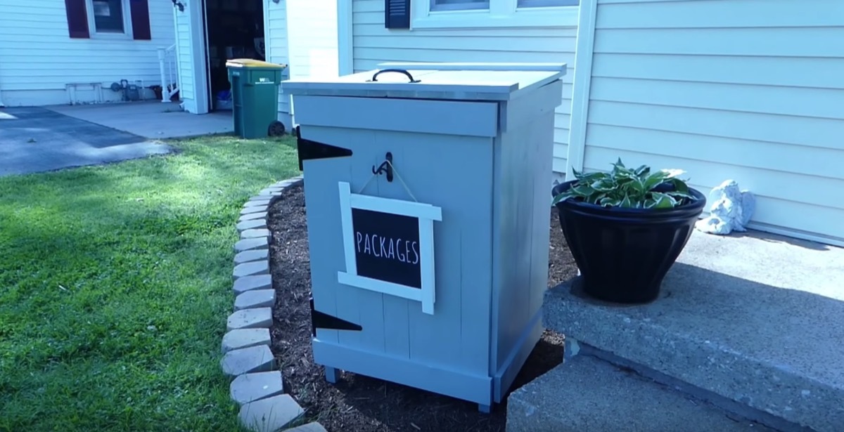 gray outdoor package mailbox with top handle