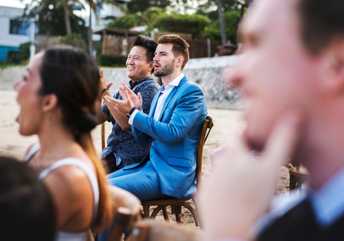 asian man and white man attend beach wedding, craziest things brides and grooms have ever done