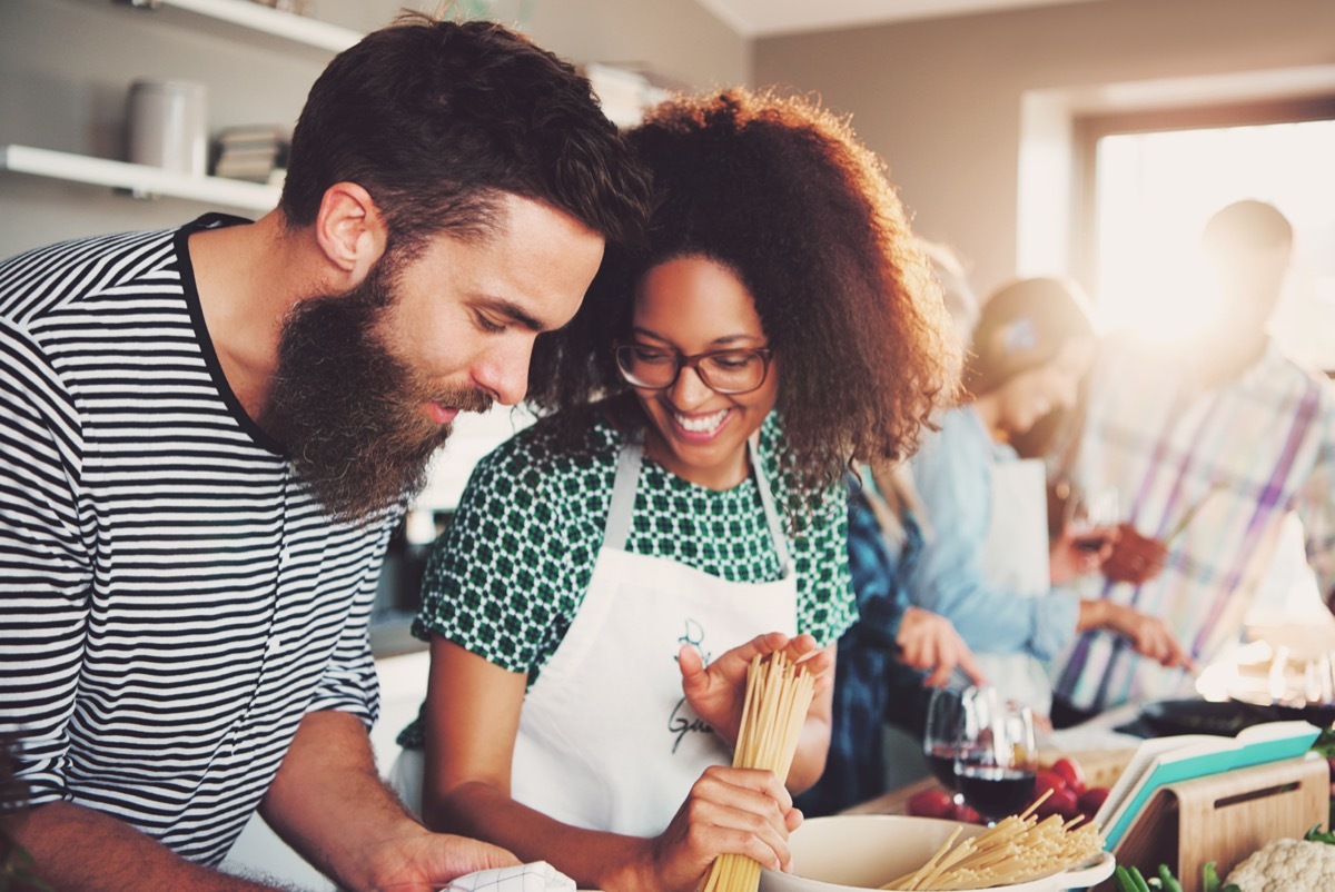 couple spending their first date at a cooking class