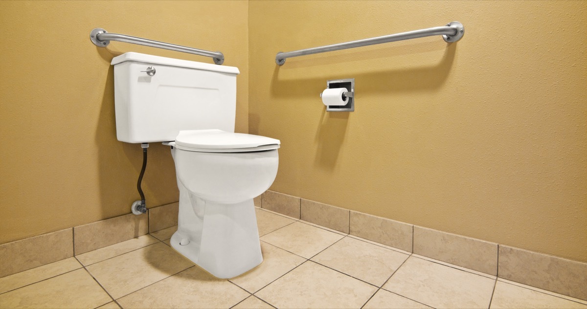 public restroom with toilet and safety bar