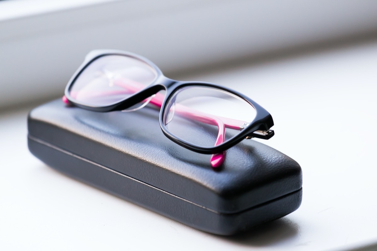 eye glasses and leather case in white background