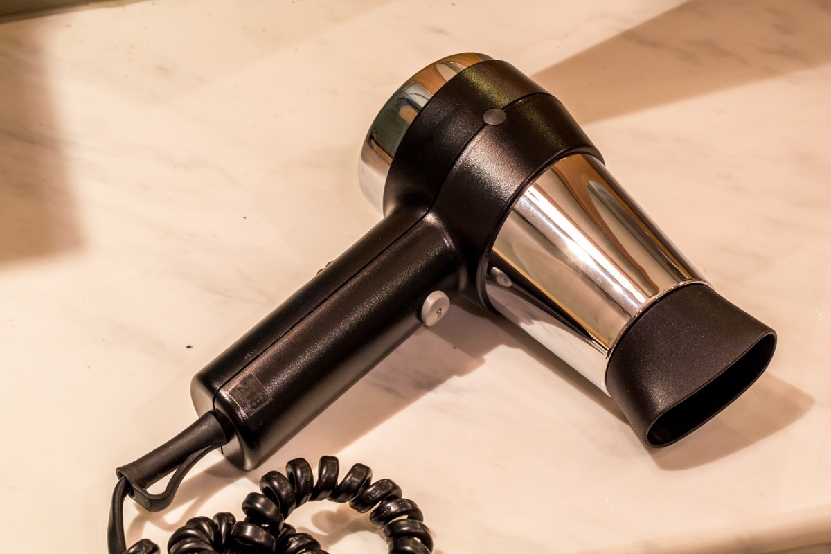 A hair dryer sitting on the counter