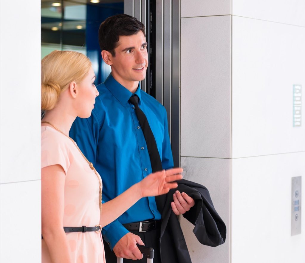 elevator etiquette putting on jacket