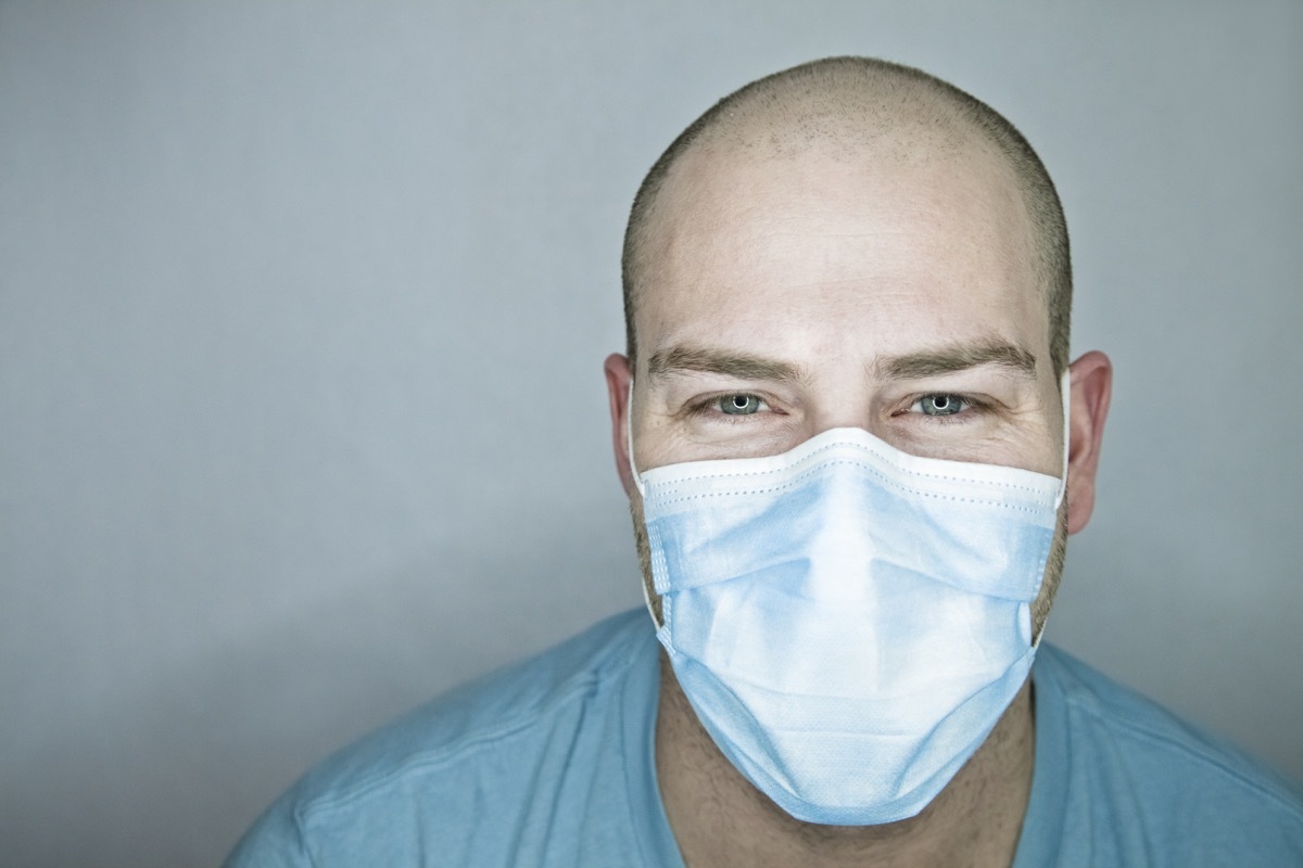 balding man wearing a mask