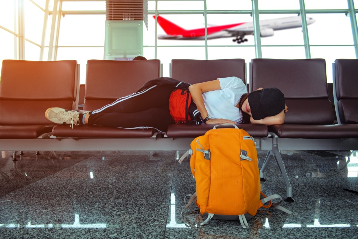 woman dressing like she just woke up, at the airport