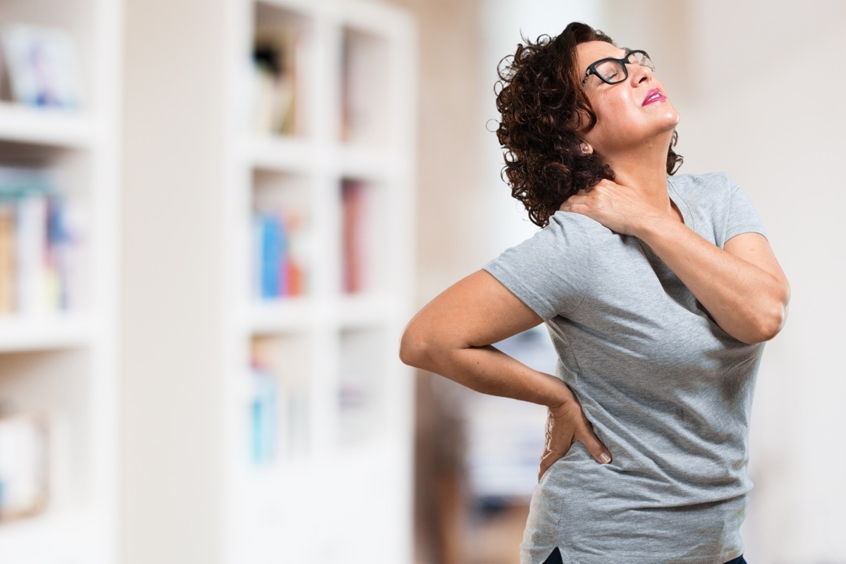 Woman with neck back pain