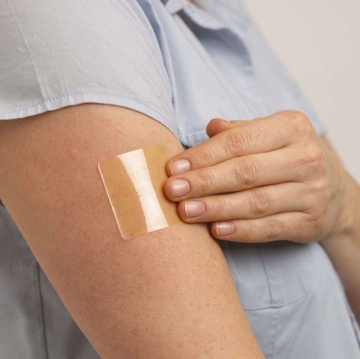 Nicotine patch on woman's arm