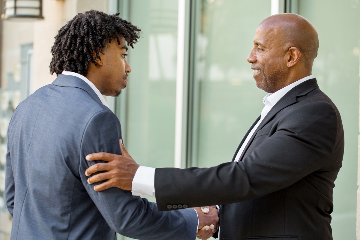 senior businessman mentoring younger man