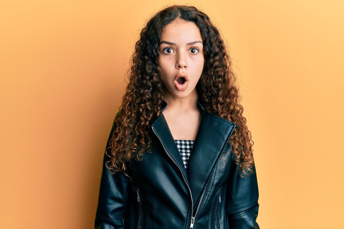 teenage girl looking shocked as she learns answers to science quiz questions