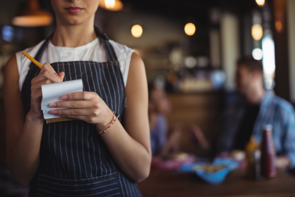 Woman working as a waitress at a restaurant