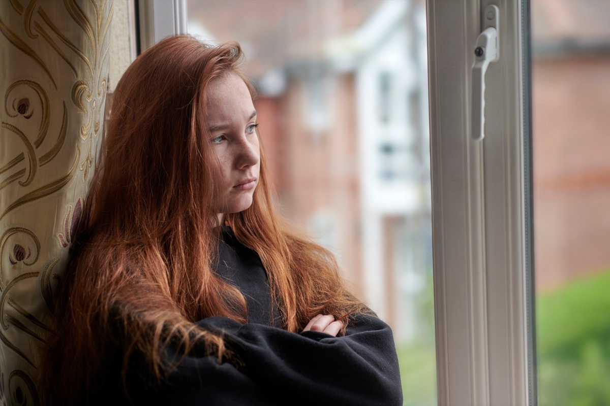 Moody Young Girl Staring Out the Window