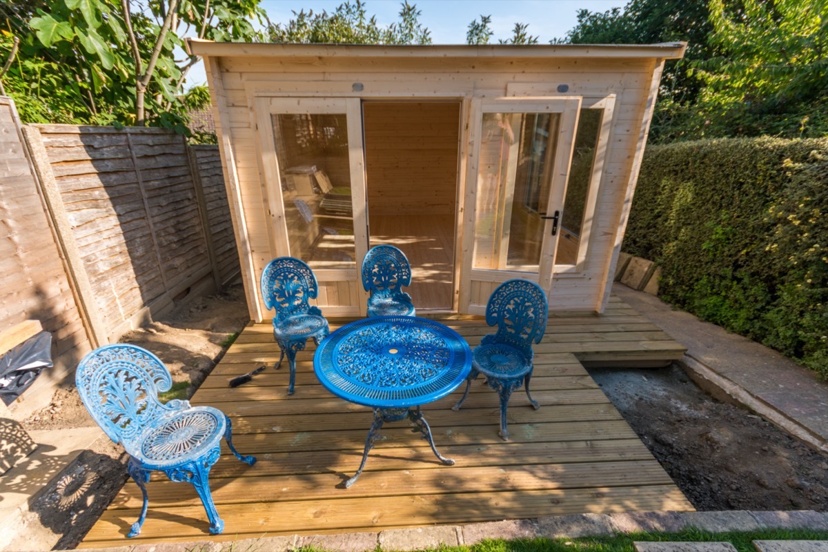 patio furniture in front of backyard shed