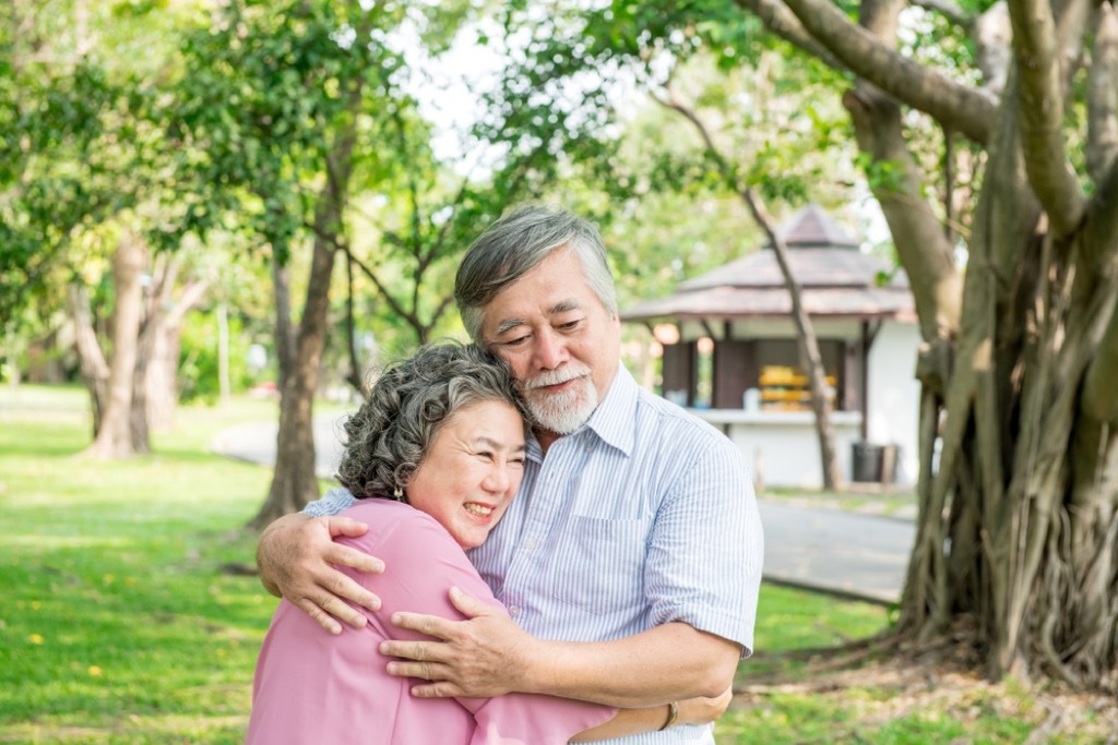 older couple hugging outdoors {Find Happiness}