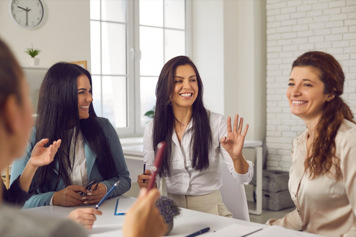 charismatic woman in corporate meeting