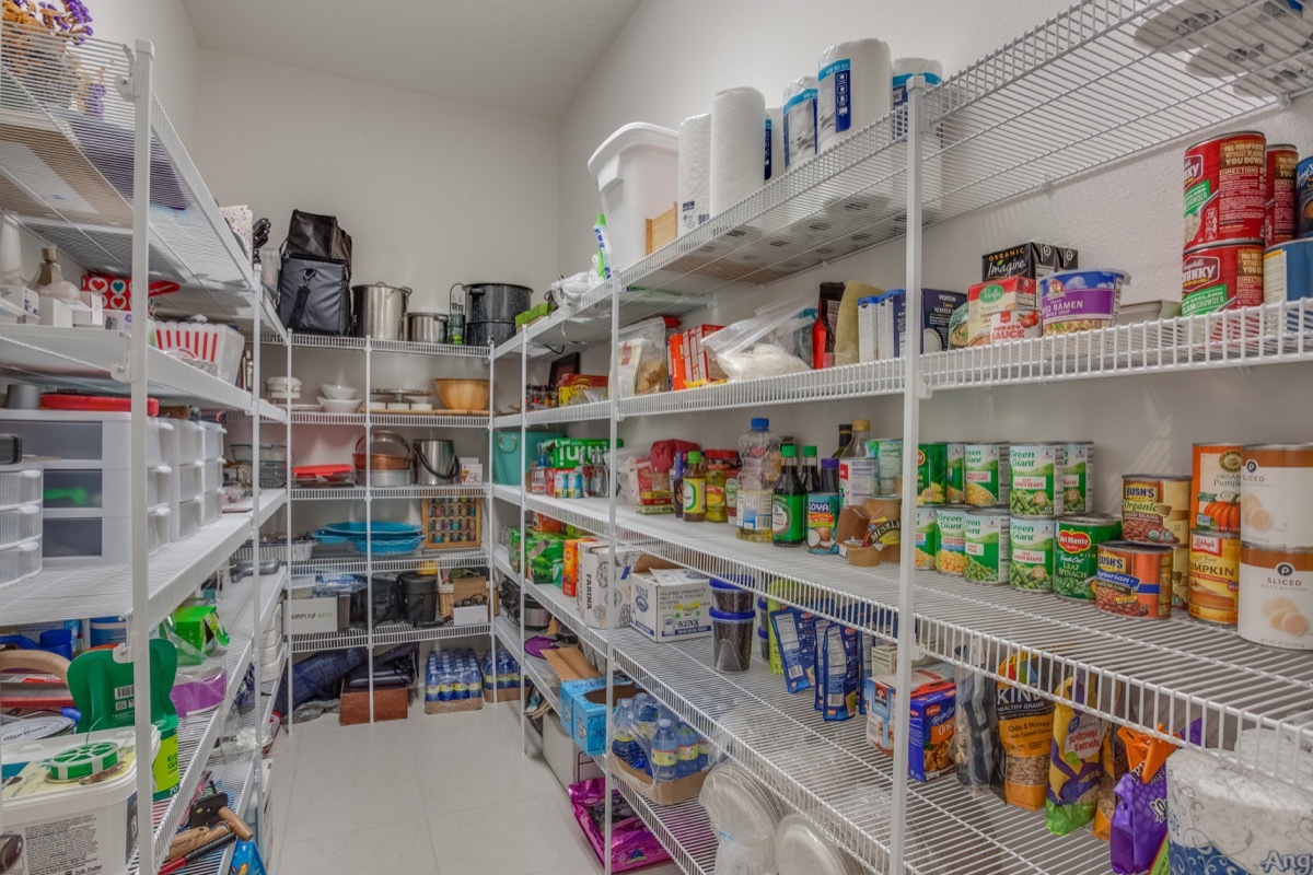 Rows of food in a neatly organized kitchen pantry