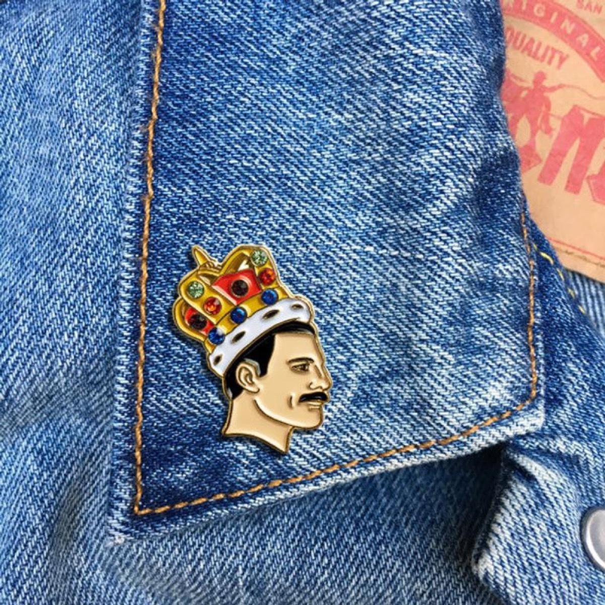 small enamel freddie mercury pin on a jean jacket