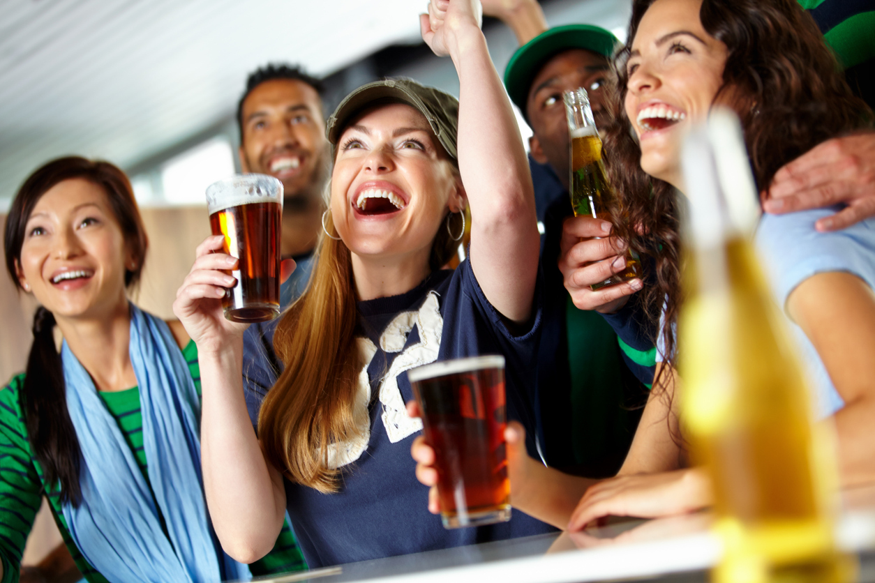 group of sports fans cheering together