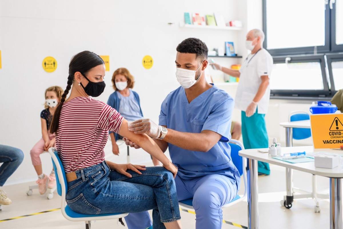 Woman getting COVID vaccine