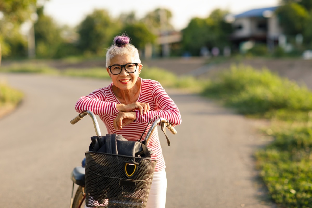 Asian senior woman on bike