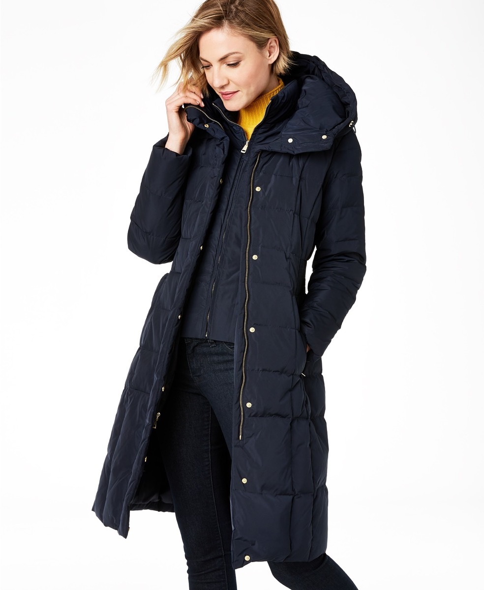 Young white woman wearing black puffer coat