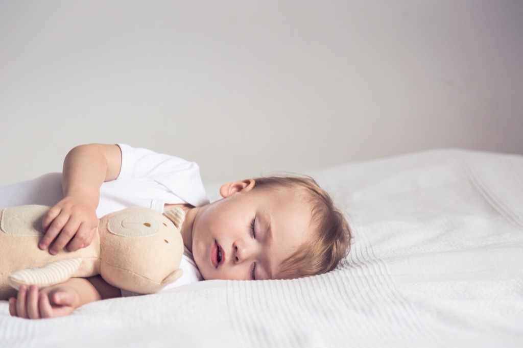 baby napping with teddy bear