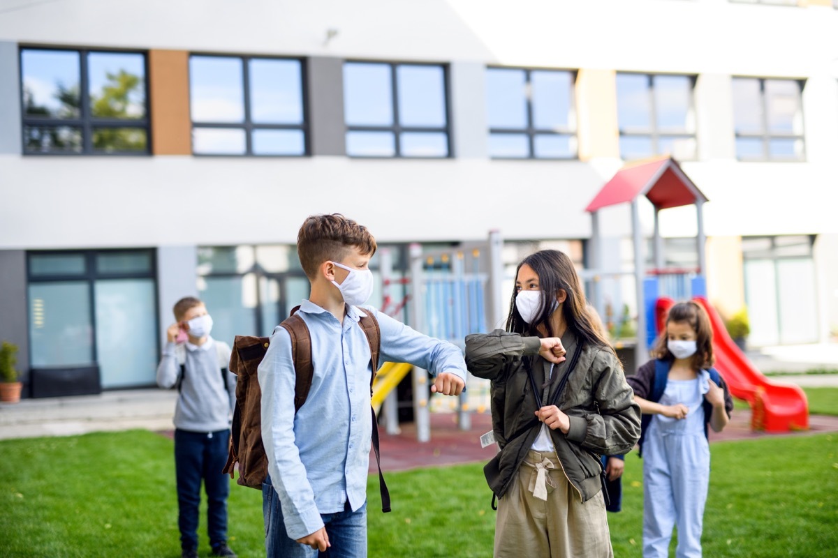 Small group of kids with masks