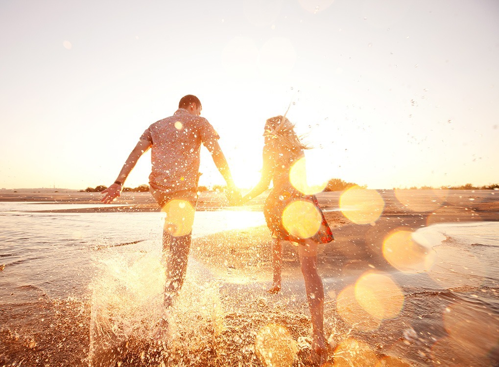 couple on beach happier