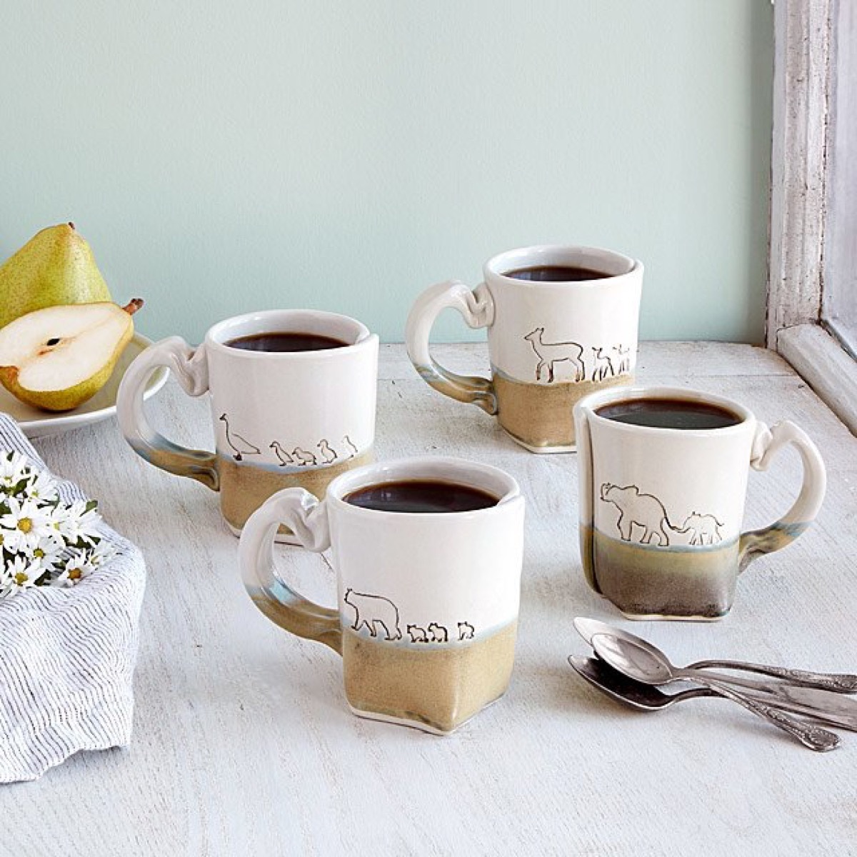 set of four mugs with animal outlines sitting on a table, mother daughter gifts