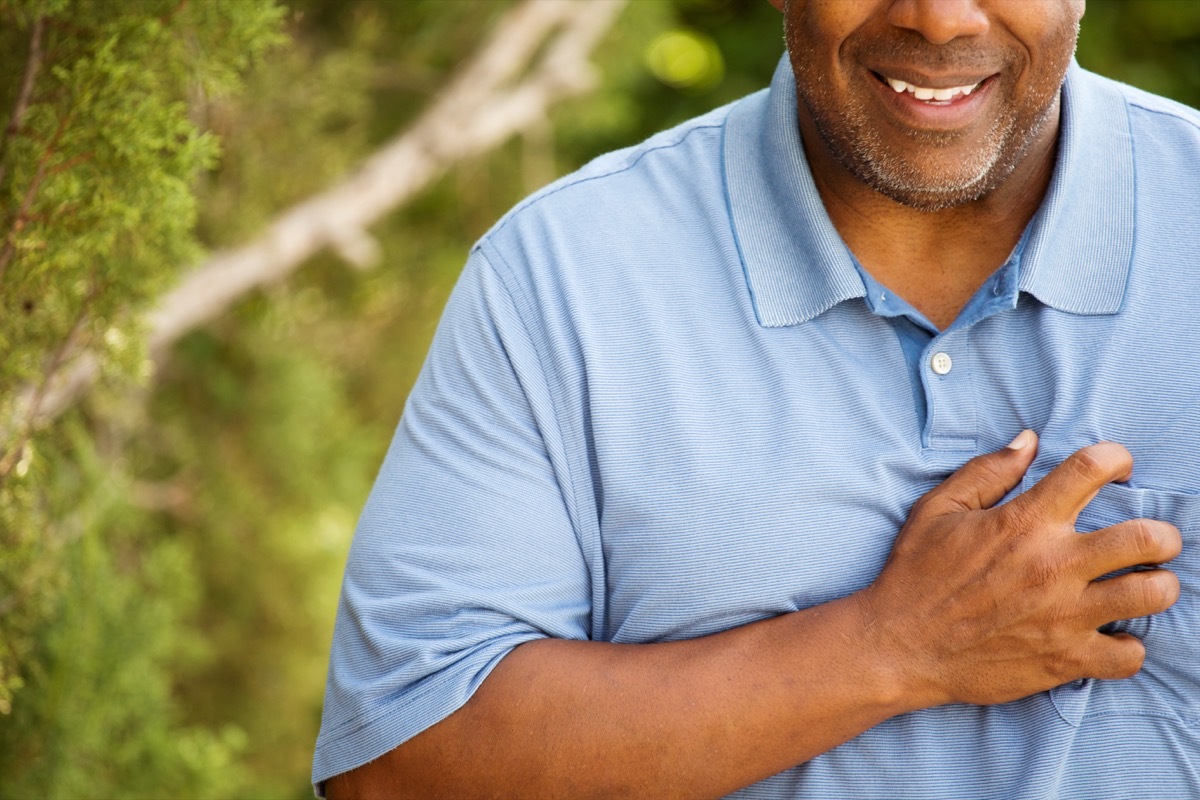 man clutching heart