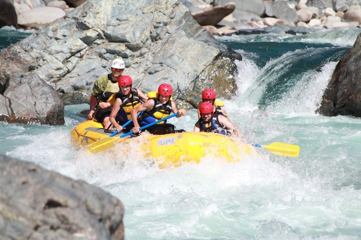 Family white-water rafting together