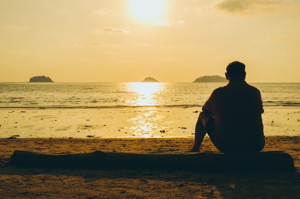 demisexual man alone on beach