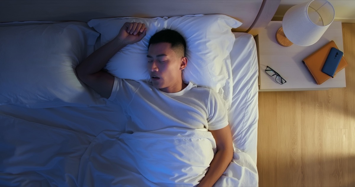 top view of young man snores when he sleep at night