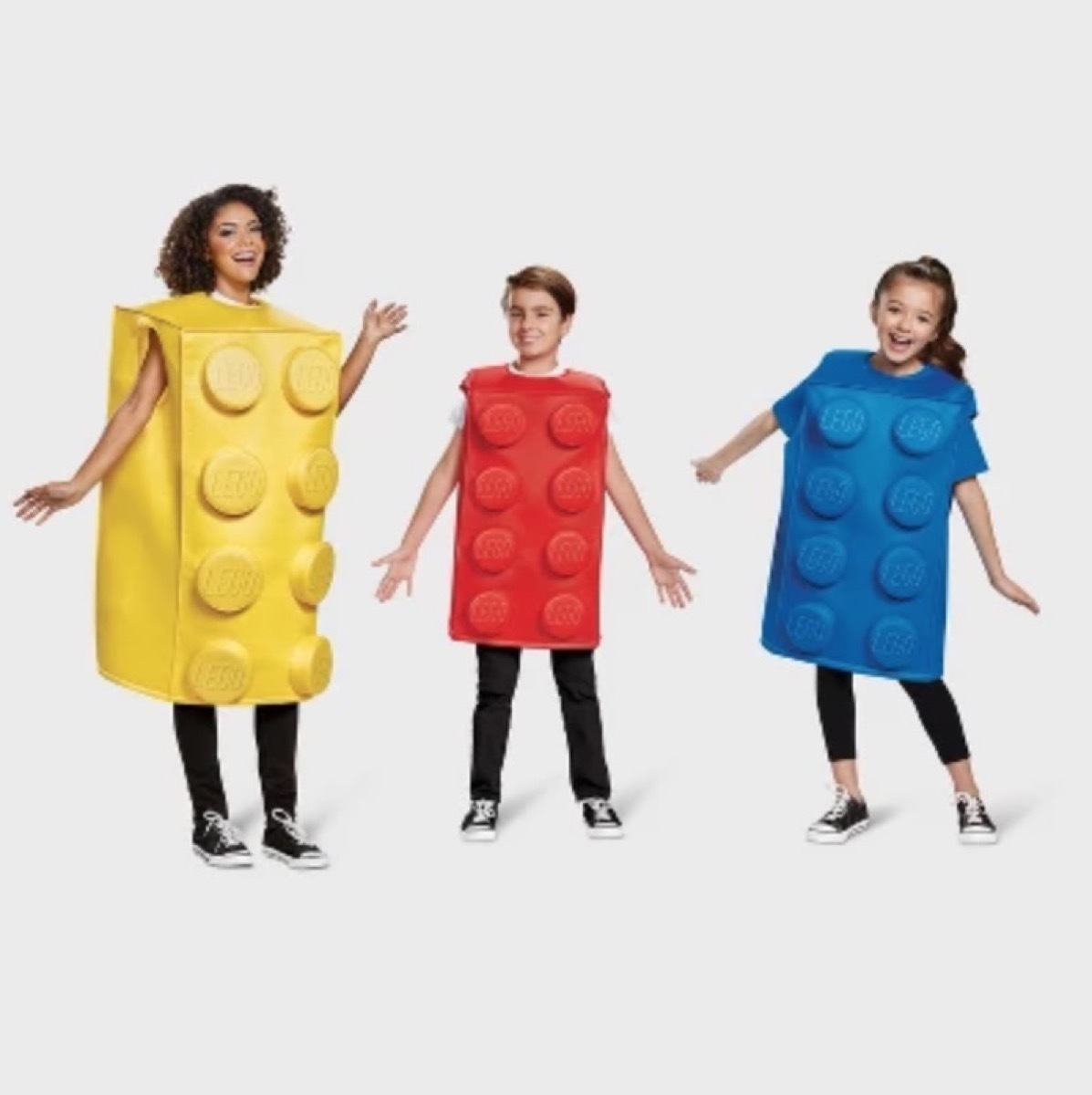 woman and two children in yellow, red, and blue lego brick costumes, family halloween costumes