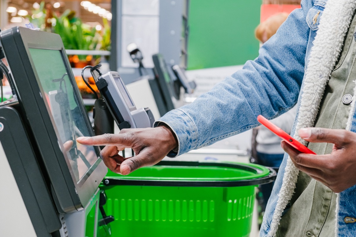 man in close-up at the supermarket checkout