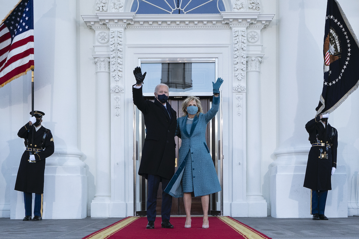 President Joe Biden and first lady Dr. Jill Biden wave as they arrive at the North Portico of the White House, on January 20, 2021, in Washington, DC. United States.